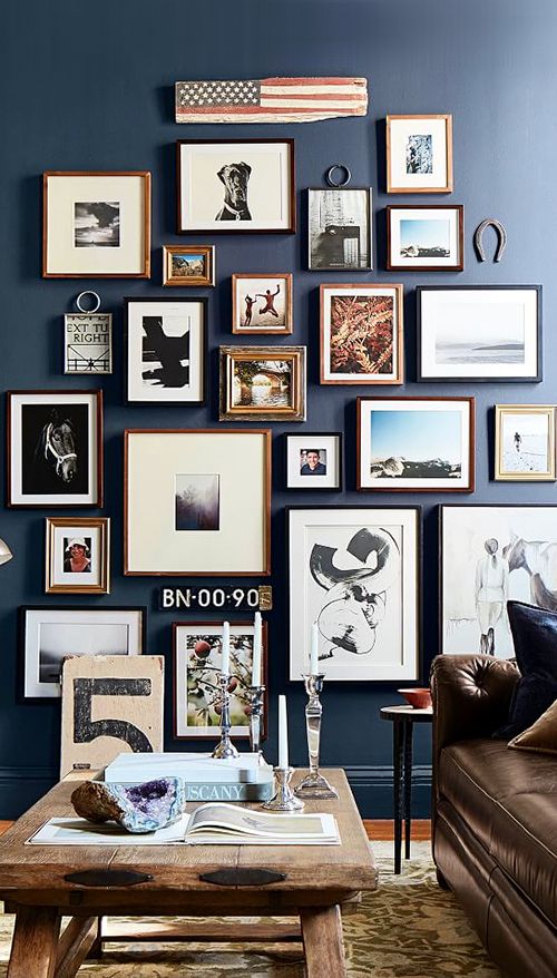 Symmetrical grid of matching frames on a white wall